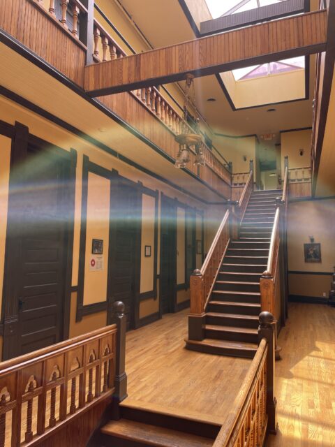 interior stairwell of the historic Columbian Apartment building, showing the natural light from the skylights