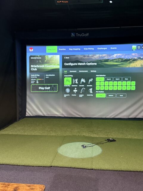 one of the virtual golfing and gaming bays at the Green Standard Golf Lounge